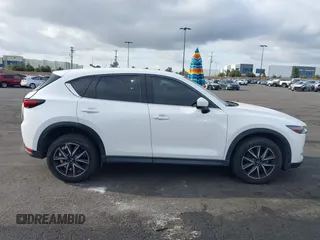 2018 Mazda CX-5 Grand Touring with VIN JM3KFADMXJ0470846, listed as a IAAI auction lot 41913533 with 54,700 mi miles and . Bid and sale history available at DreamBid. Image 14.