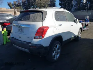 2015 Chevrolet Trax LTZ with VIN KL7CJTSB3FB235433, listed as a IAAI auction lot 41191943 with 157,297 mi miles. Bid and sale history available at carsss.com. Image 4.