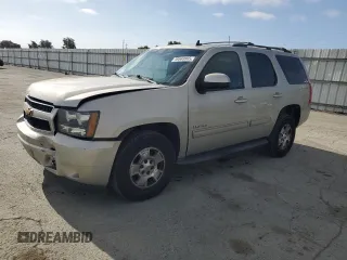 2014 Chevrolet Tahoe LT with VIN 1GNSKBE01ER190098, listed as a Copart auction lot 59569965 with 192,291 mi miles and Salvage title. Bid and sale history available at DreamBid. Image 1.