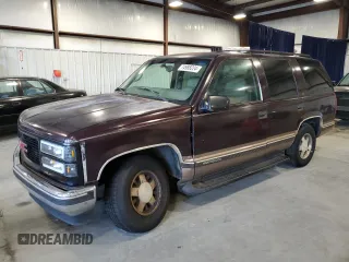 1997 GMC Yukon with VIN 1GKEC13R2VJ734299, listed as a Copart auction lot 74988224 with 225,335 mi miles and Salvage Title. Bid and sale history available at carsss.com. Image 1.