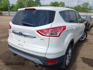 2013 Ford Escape SEL with VIN 1FMCU9HX6DUB14053, listed as a IAAI auction lot 42361297 with 144,861 mi miles and . Bid and sale history available at DreamBid. Image 4.