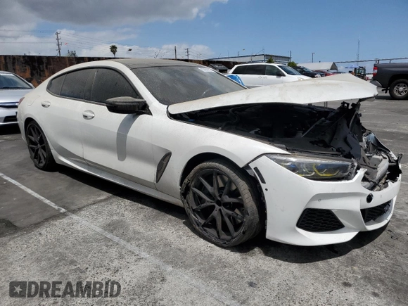 2021 BMW 8 Series M850i with VIN WBAGV8C04MCF56486, listed as a Copart auction lot 55991015 with 60,249 mi miles and Salvage title. Bid and sale history available at DreamBid. Image 4.