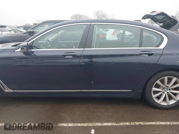 2019 BMW 7 Series 740i xDrive with VIN WBA7E4C52KGV70359, listed as a IAAI auction lot 41421504 with 55,734 mi miles and . Bid and sale history available at carsss.com. Image 14.