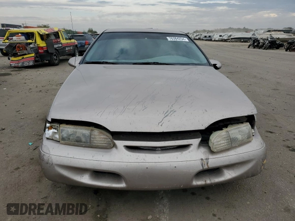 1994 Ford Thunderbird LX with VIN 1FALP6241RH110457, listed as a Copart auction lot 76384254 with 54,653 mi miles and Salvage Title. Bid and sale history available at DreamBid. Image 5.