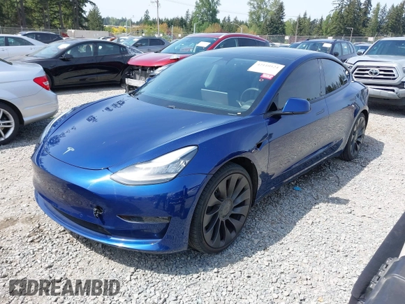 2021 Tesla Model 3 Performance with VIN 5YJ3E1EC1MF000961, listed as a IAAI auction lot 42110524 with 31,890 mi miles and . Bid and sale history available at carsss.com. Image 2.