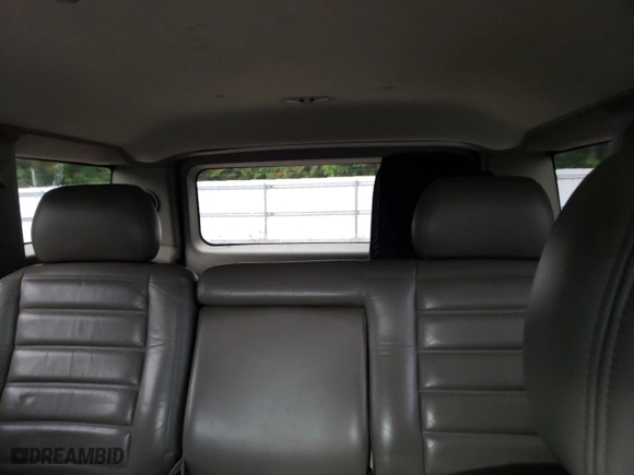 2003 Hummer H2 with VIN 5GRGN23U73H111109, listed as a Copart auction lot 76388144 with 160,179 mi miles and Salvage Title. Bid and sale history available at carsss.com. Image 10.