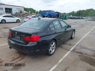 2012 BMW 3 Series 328i with VIN WBA3A5G51CNP17522, listed as a IAAI auction lot 42124868 with 154,385 mi miles and . Bid and sale history available at carsss.com. Image 4.