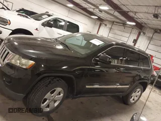 2012 Jeep Grand Cherokee Laredo with VIN 1C4RJFAG6CC266144, listed as a IAAI auction lot 41497163 with 233,755 mi miles. Bid and sale history available at carsss.com. Image 15.