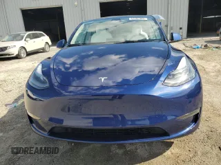2023 Tesla Model Y Long Range z VIN 7SAYGDEE3PA178832, wystawiony jako Copart lot #57156005 z przebiegiem 12 920 mil mil oraz Szkody całkowita. Historia ofert i sprzedaży dostępna na DreamBid. Obrazek 5.