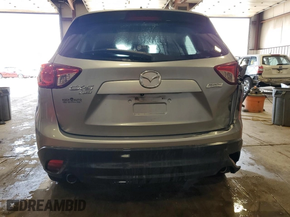 2014 Mazda CX-5 Touring z VIN JM3KE4CY5E0393463, wystawiony jako Copart lot #57776665 z przebiegiem 91 565 mil mil oraz Szkoda całkowita • Salvage title. Historia ofert i sprzedaży dostępna na DreamBid. Obrazek 6.