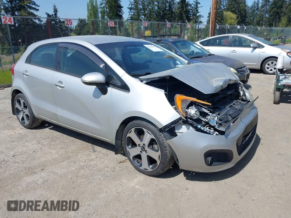 2014 Kia Rio SX with VIN KNADN5A31E6353714, listed as a IAAI auction lot 42127657 with 117,544 mi miles. Bid and sale history available at carsss.com. Image 1.