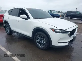 2020 Mazda CX-5 Touring with VIN JM3KFACM0L0738615, listed as a IAAI auction lot 41923923 with 52,599 mi miles. Bid and sale history available at carsss.com. Image 1.