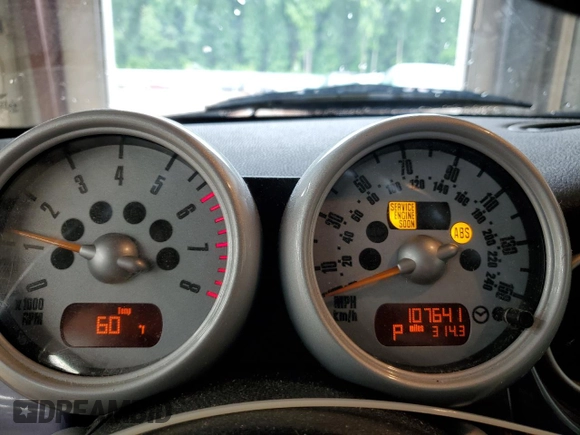 2005 MINI Convertible with VIN WMWRF33485TG10496, listed as a Copart auction lot 58582955 with 107,641 mi miles and Salvage title. Bid and sale history available at DreamBid. Image 9.