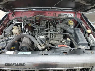 1999 Jeep Cherokee Sport with VIN 1J4FT68S2XL656679, listed as a Copart auction lot 88145875 with 254,038 mi miles and Salvage title. Bid and sale history available at DreamBid. Image 12.
