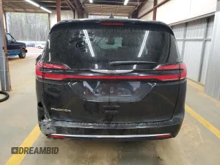 2023 Chrysler Pacifica Touring L with VIN 2C4RC1BG3PR582271, listed as a Copart auction lot 51644595 with 57,930 mi miles and Salvage title. Bid and sale history available at DreamBid. Image 6.