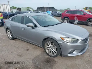 2014 Mazda 6 i Grand Touring z VIN JM1GJ1W69E1125237, wystawiony jako IAAI lot #42347787 z przebiegiem 146 648 mil mil oraz . Historia ofert i sprzedaży dostępna na DreamBid. Obrazek 1.