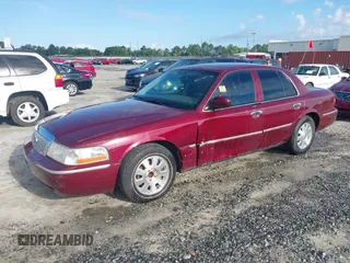 2004 Mercury Grand Marquis LS Premium z VIN 2MEFM75WX4X671041, wystawiony jako IAAI lot #42261517 z przebiegiem 107 182 mil mil oraz . Historia ofert i sprzedaży dostępna na DreamBid. Obrazek 2.