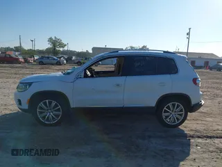 2015 Volkswagen Tiguan SE with VIN WVGAV7AX5FW600170, listed as a IAAI auction lot 41460660 with Not provided miles and . Bid and sale history available at DreamBid. Image 14.