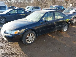 2001 Toyota Camry CE with VIN JT2BG22K210598164, listed as a IAAI auction lot 41457913 with 129,198 mi miles. Bid and sale history available at carsss.com. Image 2.