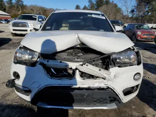 2018 BMW X1 xDrive28i with VIN WBXHT3C33J5F91744, listed as a Copart auction lot 51965855 with 75,988 mi miles and Non Repairable. Bid and sale history available at carsss.com. Image 5.