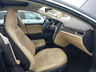 2014 Tesla Model S 60 with VIN 5YJSA1H10EFP30234, listed as a IAAI auction lot 42182249 with 186,654 mi miles and . Bid and sale history available at DreamBid. Image 5.