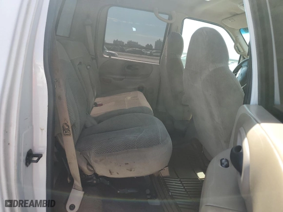 2001 Ford F-150 SuperCrew XLT with VIN 1FTRW07W41KE02772, listed as a Copart auction lot 73586724 with 0 mi miles and Salvage Title. Bid and sale history available at carsss.com. Image 10.