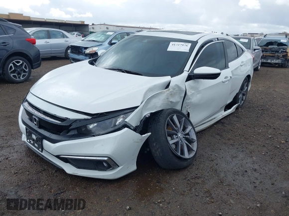 2019 Honda Civic EX-L z VIN 19XFC1F70KE202584, wystawiony jako IAAI lot #41727976 z przebiegiem 67 891 mil mil oraz . Historia ofert i sprzedaży dostępna na DreamBid. Obrazek 17.