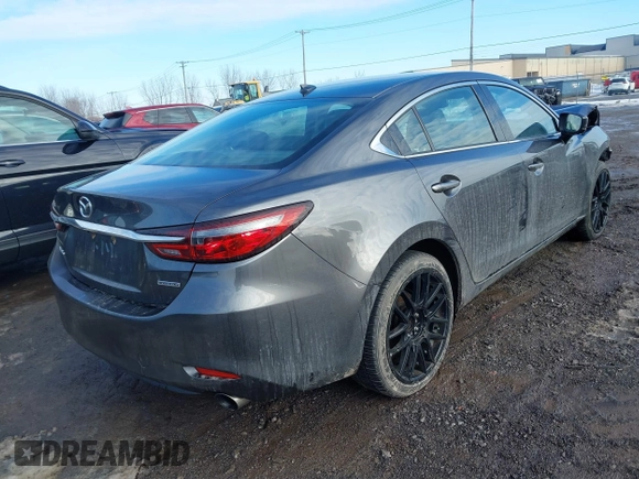 2020 Mazda 6 Grand Touring with VIN JM1GL1TY0L1521859, listed as a IAAI auction lot 41634368 with 36,709 mi miles and . Bid and sale history available at DreamBid. Image 4.
