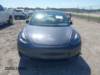 2023 Tesla Model 3 with VIN 5YJ3E1EA8PF626235, listed as a IAAI auction lot 42022893 with 30,333 mi miles and . Bid and sale history available at DreamBid. Image 6.