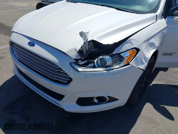 2016 Ford Fusion Titanium z VIN 3FA6P0SU2GR357508, wystawiony jako IAAI lot #42551834 z przebiegiem 177 425 mil mil oraz . Historia ofert i sprzedaży dostępna na DreamBid. Obrazek 6.