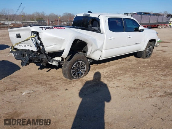 2021 Toyota Tacoma 4WD SR5 with VIN 3TYDZ5BN3MT001860, listed as a IAAI auction lot 41269423 with 23,378 mi miles. Bid and sale history available at carsss.com. Image 4.