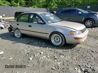 1995 Toyota Corolla DX with VIN 2T1AE09B0SC098739, listed as a Copart auction lot 57653205 with 154,226 mi miles and Salvage title. Bid and sale history available at DreamBid. Image 13.
