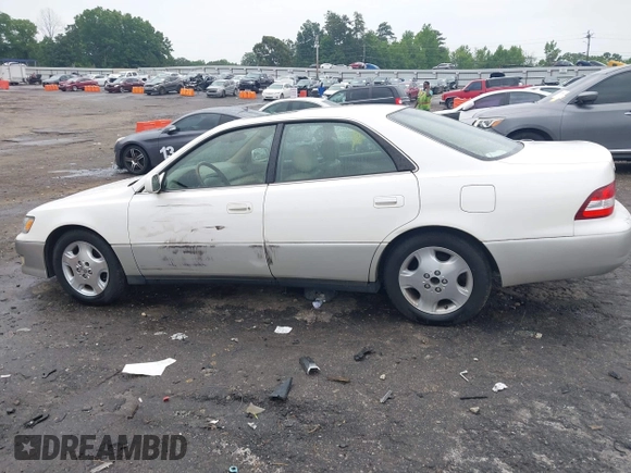 2001 Lexus ES 300 z VIN JT8BF28G410307451, wystawiony jako IAAI lot #42369871 z przebiegiem 290 620 mil mil oraz . Historia ofert i sprzedaży dostępna na DreamBid. Obrazek 14.