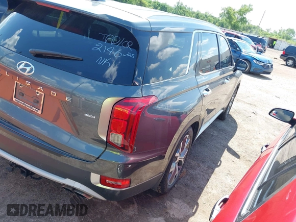 2021 Hyundai Palisade SEL z VIN KM8R4DHE2MU184984, wystawiony jako IAAI lot #42221108 z przebiegiem 107 960 mil mil oraz . Historia ofert i sprzedaży dostępna na DreamBid. Obrazek 4.