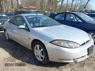 1999 Mercury Cougar z VIN 1ZWFT61L9X5660881, wystawiony jako IAAI lot #41886096 z przebiegiem 112 482 mil mil oraz . Historia ofert i sprzedaży dostępna na DreamBid. Obrazek 1.