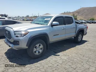 2019 Toyota Tacoma SR with VIN 3TMCZ5AN2KM277551, listed as a Copart auction lot 61586585 with 59,670 mi miles and Salvage title. Bid and sale history available at DreamBid. Image 1.
