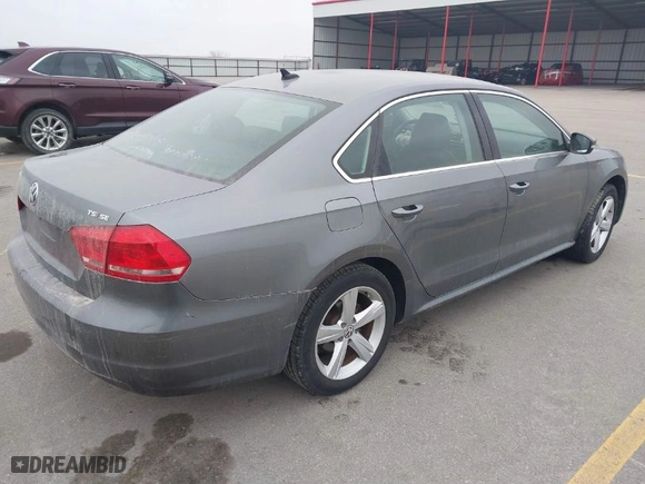 2015 Volkswagen Passat 1.8T SE w/Sunroof & Nav with VIN 1VWBT7A31FC025642, listed as a IAAI auction lot 41174819 with 120,023 mi miles. Bid and sale history available at carsss.com. Image 4.