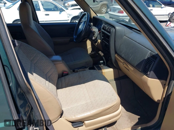 1999 Jeep Cherokee Sport with VIN 1J4FF68S0XL640066, listed as a IAAI auction lot 42768166 with 196,290 mi miles and . Bid and sale history available at DreamBid. Image 5.