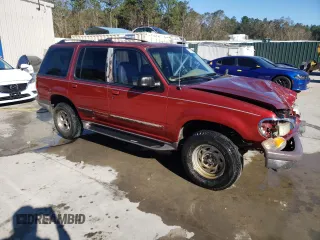 1997 Ford Explorer XL with VIN 1FMDU32E8VZC21604, listed as a Copart auction lot 81987654 with 156,141 mi miles and Salvage title. Bid and sale history available at DreamBid. Image 4.