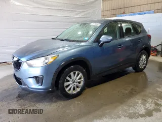 2015 Mazda CX-5 Sport z VIN JM3KE4BY9F0552942, wystawiony jako Copart lot #54750245 z przebiegiem 129 700 mil mil oraz Szkoda całkowita • Salvage title. Historia ofert i sprzedaży dostępna na DreamBid. Obrazek 1.