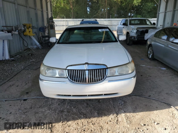 1999 Lincoln Town Car Executive with VIN 1LNHM81W2XY658371, listed as a Copart auction lot 60249045 with 191,266 mi miles and Salvage title. Bid and sale history available at DreamBid. Image 5.