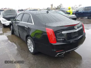 2014 Cadillac CTS Luxury AWD with VIN 1G6AX5SX3E0156938, listed as a IAAI auction lot 41574318 with 151,585 mi miles and . Bid and sale history available at DreamBid. Image 3.