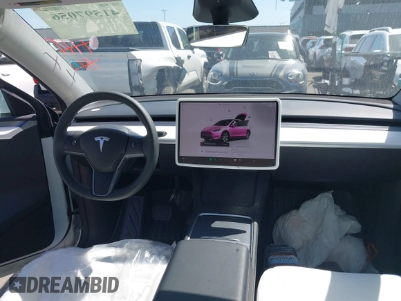 2024 Tesla Model Y with VIN 7SAYGDED2RF017448, listed as a IAAI auction lot 41597056 with 9,702 mi miles and . Bid and sale history available at DreamBid. Image 20.