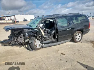 2014 Chevrolet Suburban LT with VIN 1GNSCJE09ER187344, listed as a Copart auction lot 61801315 with 168,661 mi miles and Salvage title. Bid and sale history available at DreamBid. Image 1.