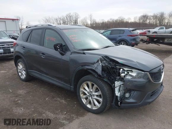 2014 Mazda CX-5 Grand Touring with VIN JM3KE4DY4E0343863, listed as a IAAI auction lot 41770402 with 117,615 mi miles. Bid and sale history available at carsss.com. Image 1.