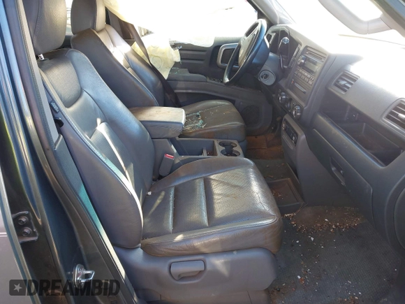 2010 Honda Ridgeline RTL with VIN 5FPYK1F52AB004678, listed as a IAAI auction lot 41661968 with 169,021 mi miles. Bid and sale history available at carsss.com. Image 5.