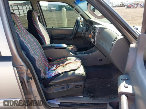 2003 Ford Explorer Sport Trac XLS z VIN 1FMZU77E63UA25807, wystawiony jako IAAI lot #42104625 z przebiegiem 230 608 mil mil oraz . Historia ofert i sprzedaży dostępna na DreamBid. Obrazek 5.