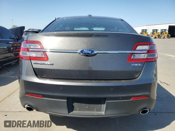 2015 Ford Taurus SEL z VIN 1FAHP2E86FG203425, wystawiony jako Copart lot #52261295 z przebiegiem 78 575 mil mil oraz Szkoda całkowita • Salvage title. Historia ofert i sprzedaży dostępna na DreamBid. Obrazek 6.