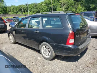 2004 Ford Focus ZTW with VIN 1FAFP35Z84W203676, listed as a Copart auction lot 57272835 with 183,115 mi miles and Salvage title. Bid and sale history available at DreamBid. Image 2.