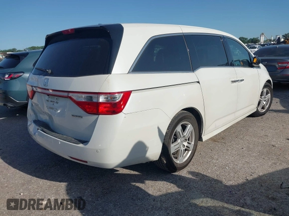 2012 Honda Odyssey Touring with VIN 5FNRL5H93CB125241, listed as a IAAI auction lot 42299053 with 125,549 mi miles and . Bid and sale history available at DreamBid. Image 4.
